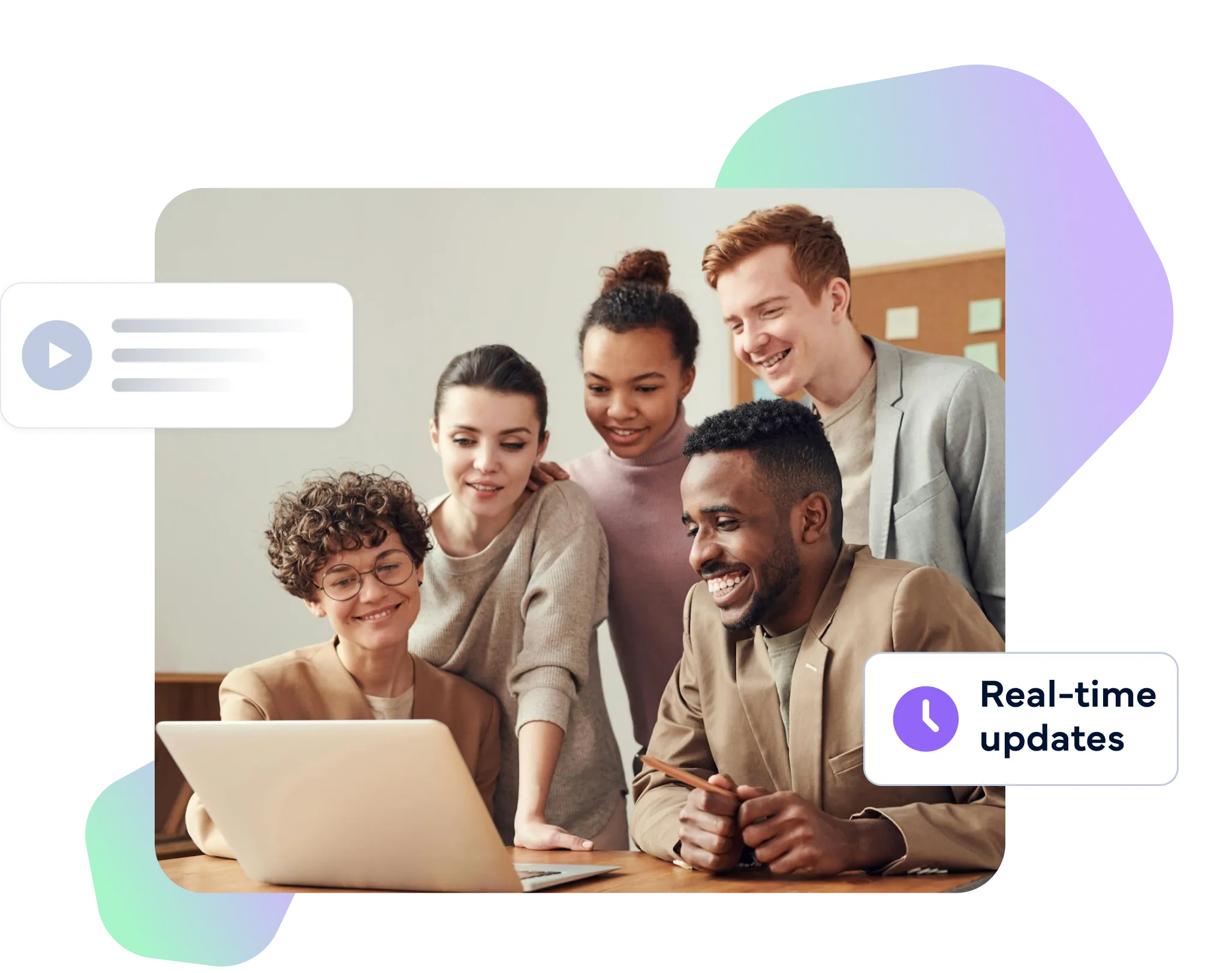 A group of co workers smiling and lookig down at a laptop on a table.